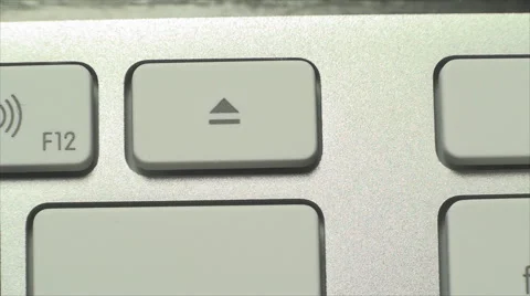 Hand Pushing The Eject Key, On A White Desktop Keyboard, Technology Stock Footage 42849335