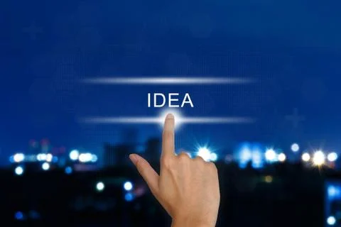 Hand pushing idea button on touch screen Stock Photos