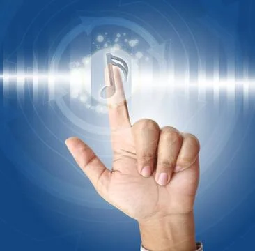 Hand pushing music button on touch screen Stock Photos