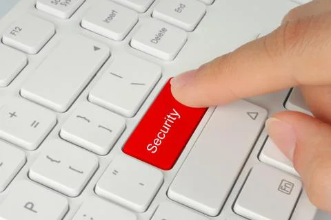 Hand pushing red security button . Stock Photos