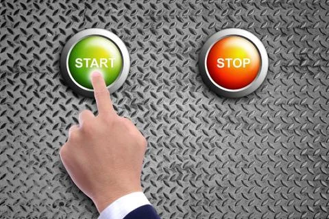 Hand pushing start button on diamond steel background Stock Photos