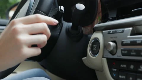 Hand pushing a start stop engine button of car. Stock Footage 169765336