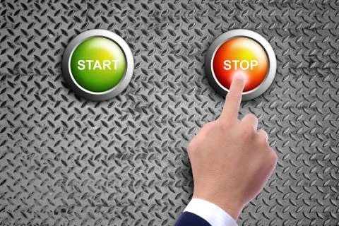 Hand pushing stop button on diamond steel background Stock Photos
