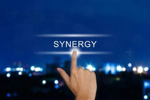 Hand pushing synergy button on touch screen Stock Photos