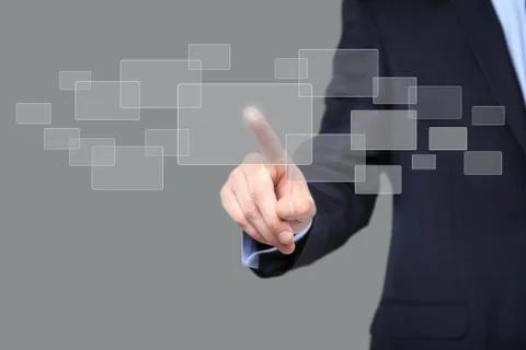 Hand pushing on a touch screen interface Stock Photos