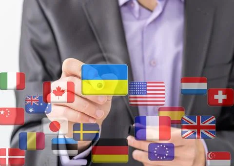 Hand pushing on a touch screen interface, choosing Ukraine. flags of the world Stock Photos