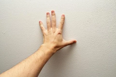 Hand pushing wall Stock Photos