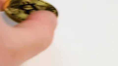 Hand put bitcoin coin on table Stock Footage 109267339