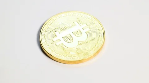 Hand put bitcoin coin on table Stock Footage 109272760