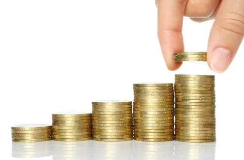 Hand put coins to stack of coins Stock Photos