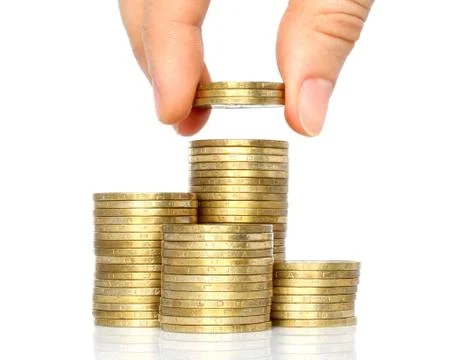 Hand put coins to stack of coins Stock Photos