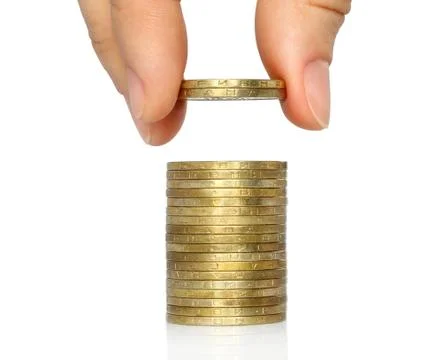 Hand put coins to stack of coins . Stock Photos