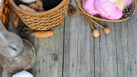 Hand put knitting work on basket and put white ball of wool. Top view Stock Footage 118254259