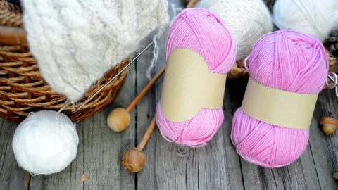 Hand put knitting work on basket and ball on vintage wood desk. Video stock 118254812