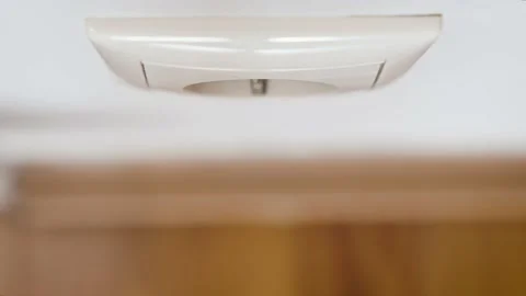 Hand put a plug into a white European electrical socket. Stock Footage 237524726