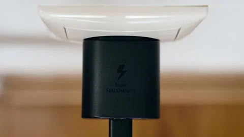 Hand put a plug into a white European electrical socket. Stock Footage 237524731