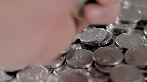 A hand put some coins of 1 real brazilian coin Stockbeeldmateriaal 58510291