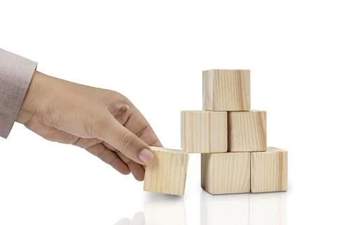 Hand put the stack of wooden block toy Foto stock
