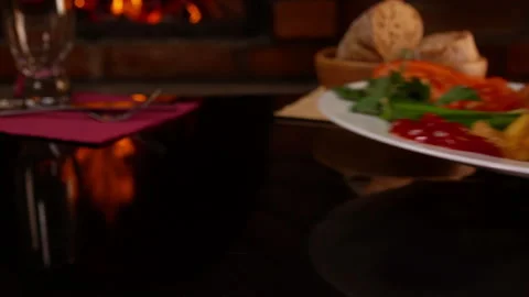 Hand put on the table a plate of fried chicken wings Stock Footage 114194097