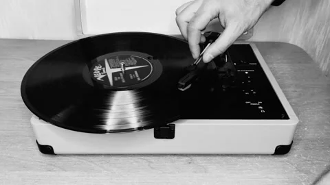 Hand put vinyl on the vinyl player. Stock Footage 188437619