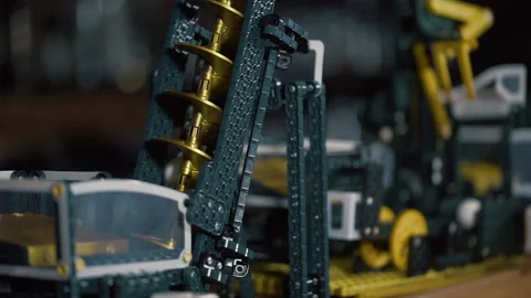 Hand puts the ball to Marble machine. rolling on the plastic path, construction Stock Footage 219256635