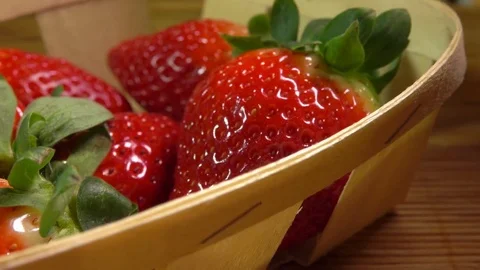 Hand puts in the basket big strawberries Stock Footage 73376172