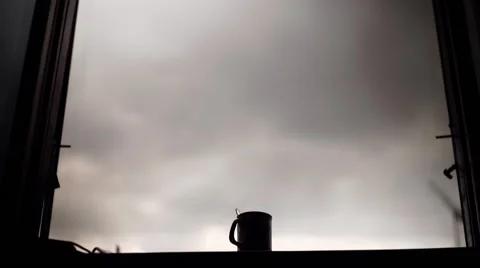 A hand puts a bottle of alcohol on a window. Dolly shot. Stock Footage 68521636