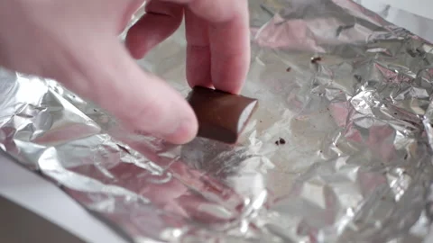 A hand puts chocolate back Stock Footage 151517757