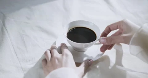 Hand puts coffe on table. Top view Stock Footage 157066589