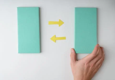 Hand puts a colored paper rectangles and arrows Stock Photos