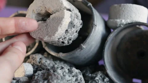The hand puts the core in the crown for drilling hard rocks of stone, concrete,g Stock Footage 128829399