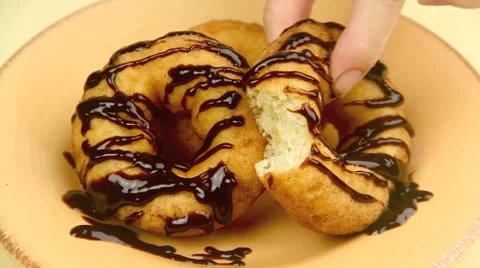 Hand puts Donut With Bite On Plate 스톡 동영상 55187423