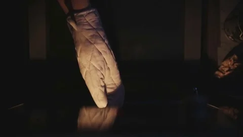Hand puts forward cakes from the oven Stock Footage 72989135