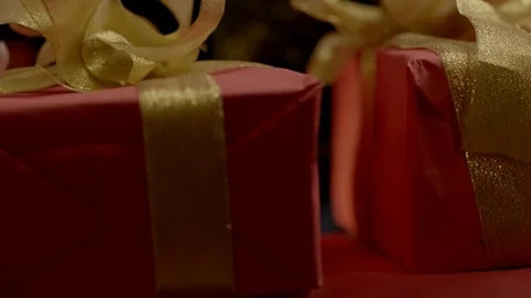 Hand puts a gift in a pile Stock Footage 77828184
