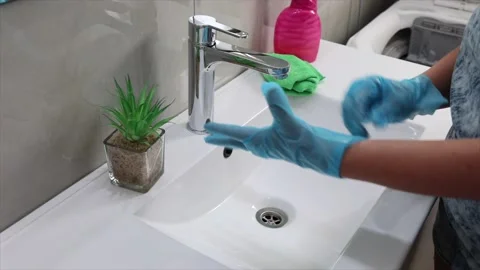 Hand puts on gloves to wash the sink.slow motion.4k Stock Footage 220150214