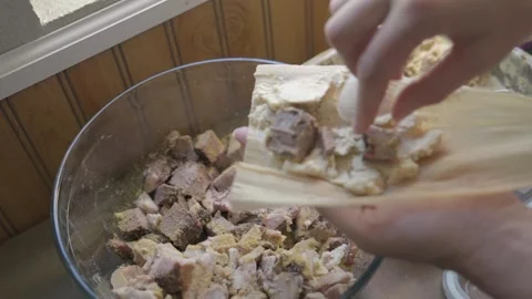 Hand puts meat in tamale Stock Footage 251047265