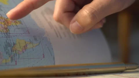 Hand puts a pen in the form of a feather on a notebook Stock Footage 138730197