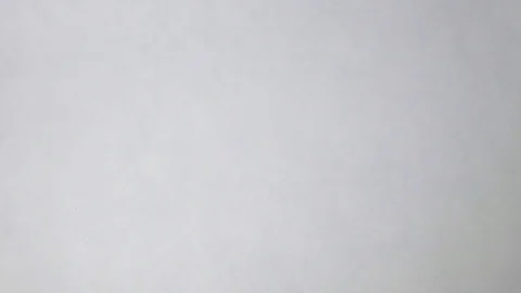 Hand puts a plastic bag with dollars and euro on the white background Stock Footage 71229936