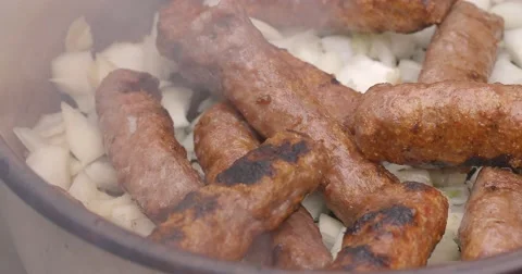 Hand puts roast meat in pot Video stock 62816383