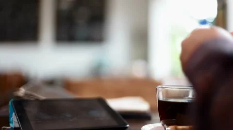Hand puts sugar in coffee and stirrs before consuming Video stock 65889593