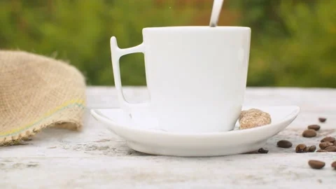 Hand puts sugar into a cup of coffee Stock Footage 141602043