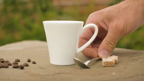 Hand puts sugar into a cup Stock Footage 141601788