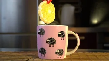 Hand puts tea in lemon Stock Footage 86149864