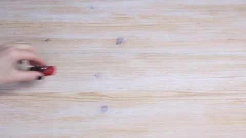 Hand puts USB flash drive on wooden table Video stock 104076091