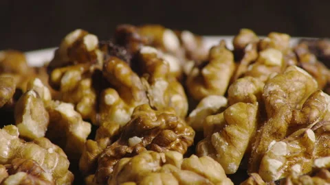 Hand puts a walnut Stock Footage 171098008