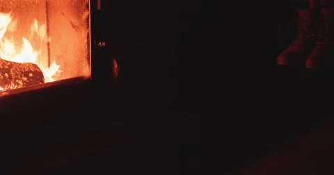 Hand puts Winter Boots to dry near Cozy Fireplace. 4K DCi SLOW MOTION 120 fps. 動画素材 67217340