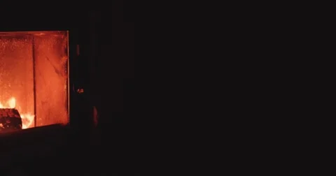 Hand puts Winter Boots to dry near Cozy Fireplace. 4K DCi SLOW MOTION 120 fps. Vidéo 67217658