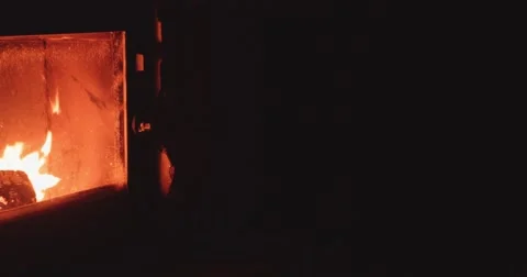 Hand puts Winter Boots to dry near Cozy Fireplace. 4K DCi SLOW MOTION 120 fps. Vidéo 67218927