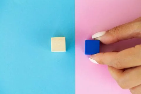 Hand putting and stacking blank wooden cubes on table with copy space for input Foto stock