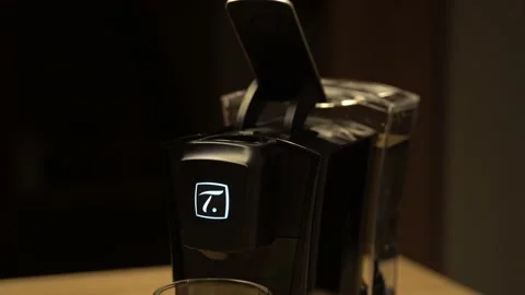 Hand putting capsule into tea machine Stock Footage 144441996